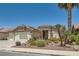 Well-maintained one-story home boasts desert landscaping, a two-car garage, and a red tile roof at 1128 Galangate Ave, Henderson, NV 89015