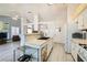 Bright, spacious kitchen featuring an island, white cabinets, and stainless steel appliances at 1128 Galangate Ave, Henderson, NV 89015