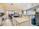 Bright kitchen with white cabinets, countertops, stainless appliances, and a breakfast nook at 1128 Galangate Ave, Henderson, NV 89015