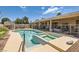 Enjoy the outdoors in this pool with spa, desert landscaping, and covered patio views at 1128 Galangate Ave, Henderson, NV 89015