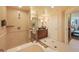 This luxurious bathroom offers a soaking tub, walk-in shower, and city views at 145 E Harmon Ave # 919, Las Vegas, NV 89109