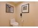 Clean and functional bathroom with toilet, telephone, and tile flooring at 145 E Harmon Ave # 919, Las Vegas, NV 89109