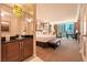 Beautiful bedroom boasts a king bed and a wall of windows overlooking the cityscape at 145 E Harmon Ave # 919, Las Vegas, NV 89109