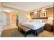 Lovely bedroom with king bed, ensuite bathroom, and comfortable seating at 145 E Harmon Ave # 919, Las Vegas, NV 89109