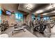 Fitness center with a variety of exercise equipment, including treadmills, bikes, and weight machines, with large windows at 145 E Harmon Ave # 919, Las Vegas, NV 89109