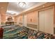 Hallway featuring patterned carpets, elevators, and table with decor for a warm welcome at 145 E Harmon Ave # 919, Las Vegas, NV 89109