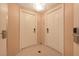 Hallway view with two white doors and neutral colors offering a clean, modern aesthetic at 145 E Harmon Ave # 919, Las Vegas, NV 89109
