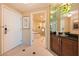 Hallway leads to a luxurious bathroom with a tub and separate shower at 145 E Harmon Ave # 919, Las Vegas, NV 89109