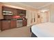 This kitchenette features dark cabinets, stainless steel appliances, and a microwave at 145 E Harmon Ave # 919, Las Vegas, NV 89109