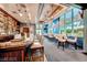 Relaxing lounge area with a bar, high-top chairs, comfortable seating, and large windows overlooking the scenery at 145 E Harmon Ave # 919, Las Vegas, NV 89109