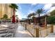 Luxury pool area with private cabanas, elegant seating, and lush palm trees at 145 E Harmon Ave # 919, Las Vegas, NV 89109