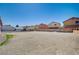 Large, empty backyard awaiting landscaping, surrounded by neighboring homes at 1847 Stevens St, Las Vegas, NV 89115