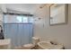 Bathroom featuring tub with shower, a window, and a sink with vanity at 1847 Stevens St, Las Vegas, NV 89115