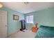 A bedroom includes carpet and a treadmill, creating a versatile space for relaxation and exercise at 1847 Stevens St, Las Vegas, NV 89115