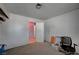 Carpeted room with door leading to another room, a window and space for different activities at 1847 Stevens St, Las Vegas, NV 89115