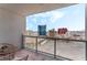 Enjoy city views from this balcony featuring seating and a scenic outlook at 200 W Sahara Ave # 3303, Las Vegas, NV 89102