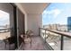 Relax on the private balcony with seating and scenic city views at 200 W Sahara Ave # 3303, Las Vegas, NV 89102