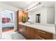 Bathroom featuring white quartz counters, stylish cabinets and a large mirror at 200 W Sahara Ave # 3303, Las Vegas, NV 89102