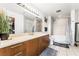 This bathroom features a deep soaking tub, tile floors, and a spacious vanity at 200 W Sahara Ave # 3303, Las Vegas, NV 89102