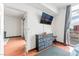 This bedroom features sleek wood floors, a modern TV, and city views at 200 W Sahara Ave # 3303, Las Vegas, NV 89102