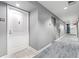 Hallway with unit number, neutral walls, and blue-gray carpet, leading to the elevator at Allure at 200 W Sahara Ave # 3303, Las Vegas, NV 89102