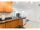 Open concept kitchen featuring a granite countertop and wooden cabinets at 200 W Sahara Ave # 3303, Las Vegas, NV 89102