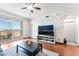 Cozy living room with a great city view, hardwood floors, and a TV at Allure Las Vegas at 200 W Sahara Ave # 3303, Las Vegas, NV 89102
