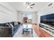 Inviting living room with hardwood floors, a comfortable sofa, and stunning city views in Allure at 200 W Sahara Ave # 3303, Las Vegas, NV 89102