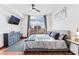 Comfortable main bedroom with a large window showcasing city skyline views at 200 W Sahara Ave # 3303, Las Vegas, NV 89102