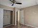Bedroom featuring wood flooring, a closet, and a doorway to another room at 2116 Bavington Dr # C, Las Vegas, NV 89108