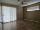 Spacious bedroom with ceiling fan, dual pane windows, and new laminate wood flooring at 2116 Bavington Dr # C, Las Vegas, NV 89108