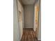 Hallway with laminate wood flooring leading to another room at 2116 Bavington Dr # C, Las Vegas, NV 89108
