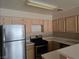 Full kitchen view showcases stainless steel appliances, plenty of cabinet space, and natural light at 2116 Bavington Dr # C, Las Vegas, NV 89108
