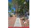 Scenic view of community walking path with trees and well-maintained landscaping alongside residences at 2116 Bavington Dr # C, Las Vegas, NV 89108