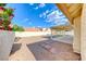 Backyard featuring an open patio, gravel landscaping, and block fence at 234 Geronimo Ct, Henderson, NV 89074