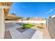 Spacious backyard featuring a covered patio, gravel landscaping, and a small patch of grass at 234 Geronimo Ct, Henderson, NV 89074