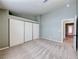 Carpeted bedroom featuring a closet with sliding doors and an en-suite bathroom at 234 Geronimo Ct, Henderson, NV 89074