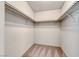 Empty walk-in closet featuring carpet and built-in clothing rods at 234 Geronimo Ct, Henderson, NV 89074