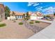 Charming single-story home with a two-car garage, tile roof, and desert landscaping at 234 Geronimo Ct, Henderson, NV 89074