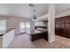 Open kitchen concept with island, dark cabinets, and backyard access at 234 Geronimo Ct, Henderson, NV 89074
