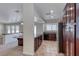 Kitchen featuring wood cabinetry, granite countertops and stainless steel refrigerator at 234 Geronimo Ct, Henderson, NV 89074