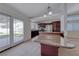 Bright kitchen with granite countertops, stainless steel appliances, and backyard access at 234 Geronimo Ct, Henderson, NV 89074