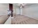 Open living room featuring plush carpets, fireplace, and views to the home entrance at 234 Geronimo Ct, Henderson, NV 89074