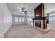 Cozy living room featuring plush carpeting, fireplace and neutral colored walls at 234 Geronimo Ct, Henderson, NV 89074