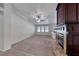 Bright and airy living room with plush carpet, fireplace, and neutral walls at 234 Geronimo Ct, Henderson, NV 89074