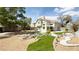 Expansive backyard featuring a large pond, meticulous landscaping, and outdoor living areas for entertaining at 2429 Worchester Rd, Henderson, NV 89074