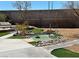 Serene backyard with a charming water feature, comfortable seating, and thoughtfully designed landscaping at 2429 Worchester Rd, Henderson, NV 89074