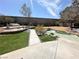 Beautiful backyard with a custom water feature, seating area, and lush landscaping for relaxation at 2429 Worchester Rd, Henderson, NV 89074