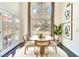 Bright dining room with natural light and stylish décor, adjacent to the backyard at 2429 Worchester Rd, Henderson, NV 89074
