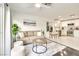 Comfortable living room flowing into a modern kitchen with stainless steel appliances at 2429 Worchester Rd, Henderson, NV 89074